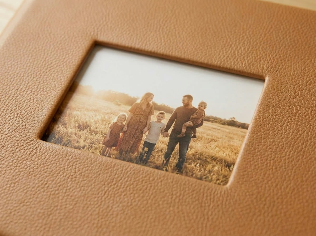 Debossed cover window framing a small family photograph
